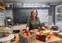 Marlene, behind the counter at The Village Shop in West Marton