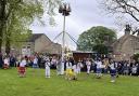 Children dance around the Maypole at Long Preston’s annual Mayday celebration.