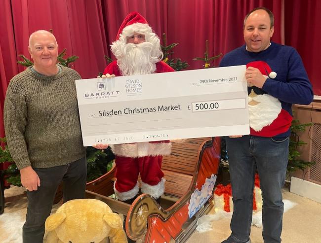 Silsden Community Group and Santa receive the donation