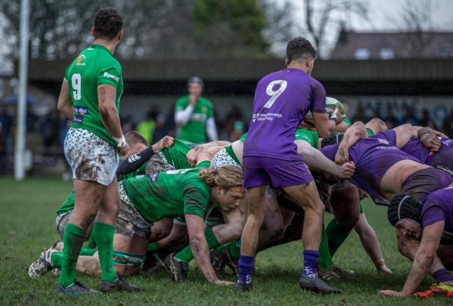 Wharfedale (green) go into a scrum with the Loughborough players