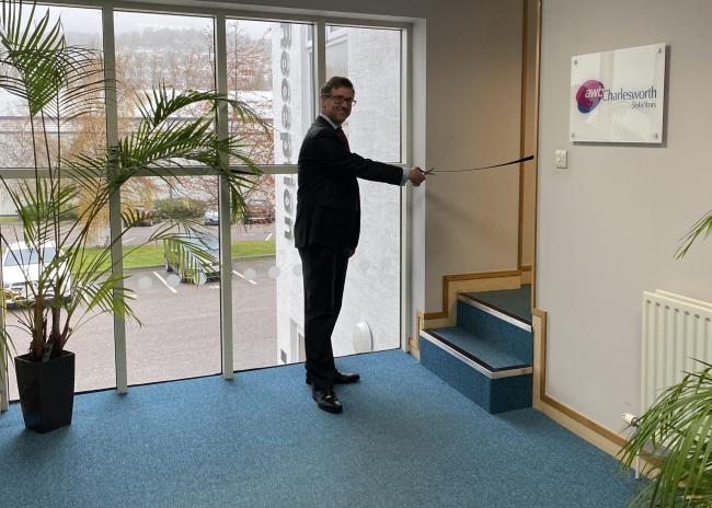 James Dunn, director, cutting the ribbon at the new premises 