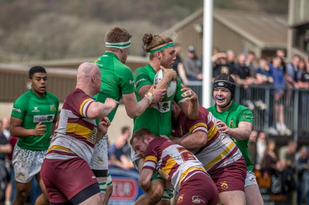 Wharfedale (green) faced off with Huddersfield (red) at the weekend. Pic: Wharfedale RUFC photos