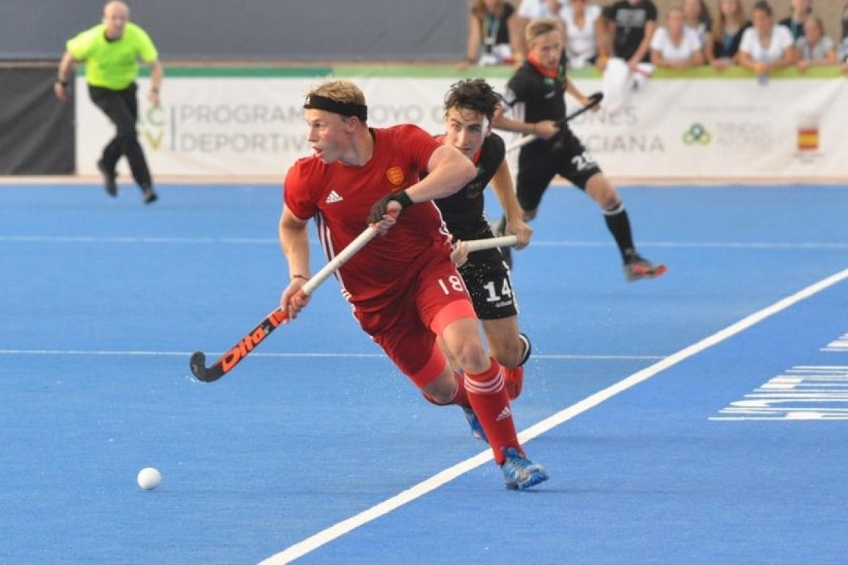 Matthew Ramshaw (red) in action. Picture: England Hockey.