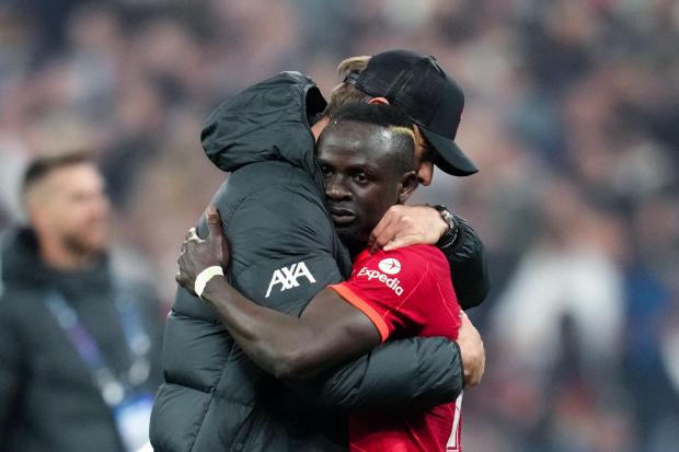 Liverpool manager Jurgen Klopp consoles Sadio Mane after losing the UEFA Champions League Final at the Stade de France, Paris. Picture date: Saturday May 28, 2022.