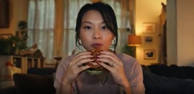 Craven Herald: A shot from the now banned Tesco advert of a woman eating a burger (Tesco/PA)