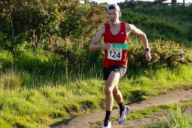 Nathan Edmondson on his way to winning the Otley Chevin fell race. Photo credit: Philip Bland