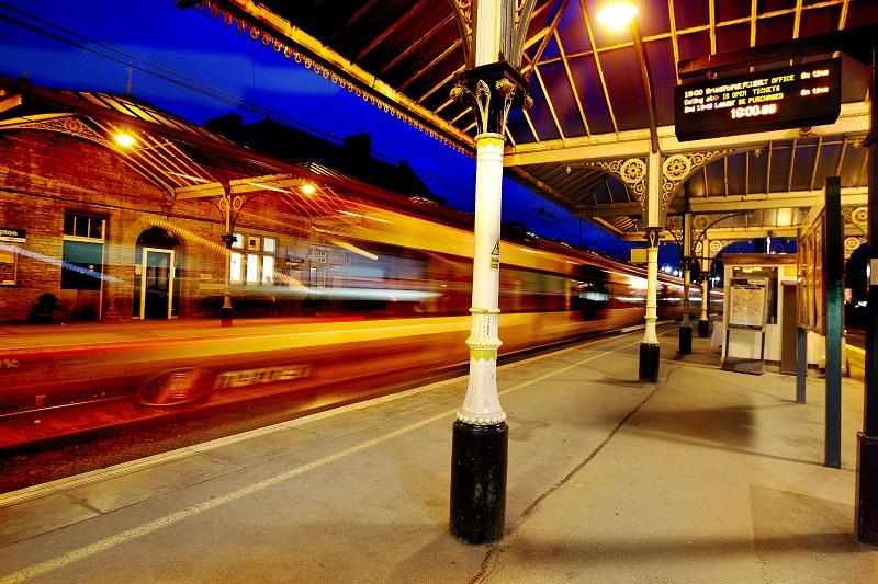 This ghostly image shows an evening train speeding through a deserted Skipton station on its way to Leeds