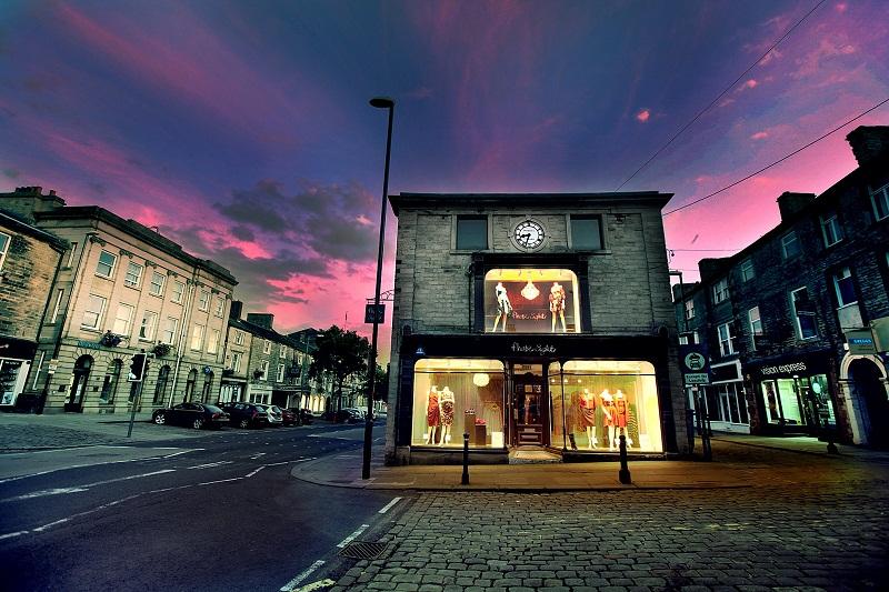 Purple hues from the sky at sunset provide a dramatic backdrop to the historic Manby’s building on Skipton High Street. 