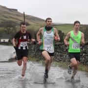 Mathew Cardus of Settle Harriers, right, won the Settle Half Marathon on Sunday. The runners are pictured at Helwith Bridge, Austwick.