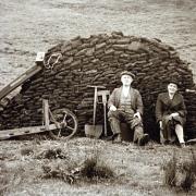 Leonard and Janet Leeming, of Slaidburn, with their turf along with their turf barrow, sled and spades on Croasdale Fell in the 1950s