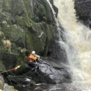 The rescue underway in December last year after a dog fell into the river at Ingleton waterfall trail. Picture CRO