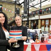 Lucy Carr, right, manager of The Cake’ole, with a jubilee cake, and Louise Ackerman from Craven Court.