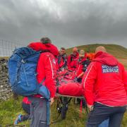 The injured DofE participant is carried back off the hill. Picture UWFRA
