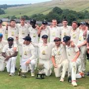 Settle’s combined squad display their league and cup trophies