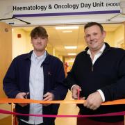 Cricketer George Hill, left, and James Bush at the official opening of the refurbished unit
