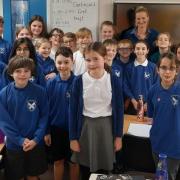 Emmerdale writer Jo Maris with pupils at Kildwick Primary School