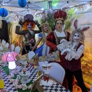 Alice at her Wonderland tea-party with other Lewis Carroll characters at a previous event in Barnoldswick