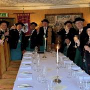 Members of the Compagnons du Beaujolais - Devoir du Skipton raise a toast