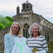 Jo, left, and Julie with the gown outside Linton church