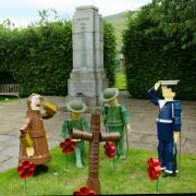 Flowerpot characters at Settle war memorial