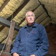Alan Mearns with the spray foam insulation in his loft space at his home in Dunnington, York