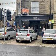 Car parked on pedestrian crossing waiting area in Skipton