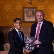 Prime Minister Rishi Sunak and Andrew Stephenson MP with the winning design by Ramona Brennan