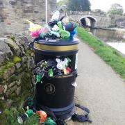 Overflowing bin on the canal towpath at Gargrave
