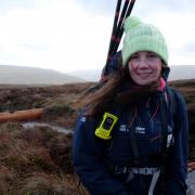 Tessa Levens on Cray Moss, beside just installed leaky dams, Wharfedale in the background.