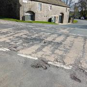 Crumbling road surface, A59 at West Marton