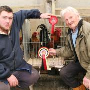 Ethan Healey, left, with his Craven Feather Auction Welsummer champions, joined by judge William Gregson.