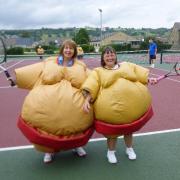 Jill Berry and Jan Abberton try out sumo tennis