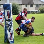 Craig Nicholson goes over for a try for Cowling Harlequins