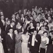 Johnson and Johnson employees enjoy a Christmas ball in the late 1950s