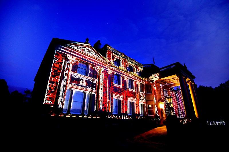 A kaleidoscope of lights project against  historic Broughton Hall for the Magic Loungeabout music festival 