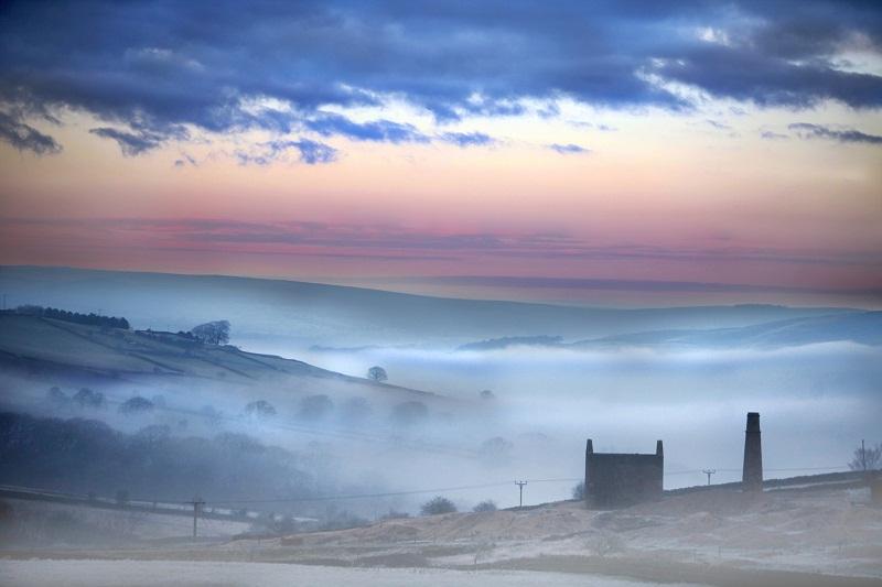 Colourful pastel hues and layers of mist and fog provide a startling backdrop to the abandoned Cononley lead mines high above the Aire Valley.