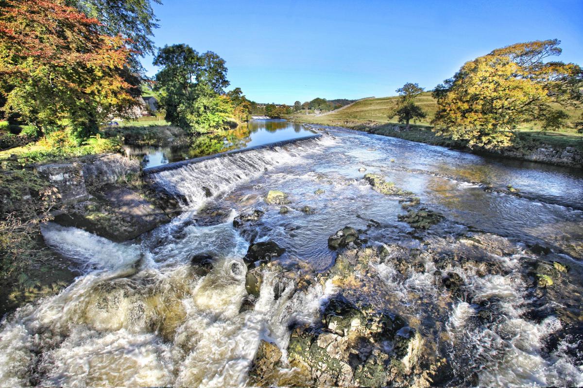 The thunderous, turbulent white waters of the River Wharfe  are superb as they pour over Linton Falls against a backdrop of early autumn colour