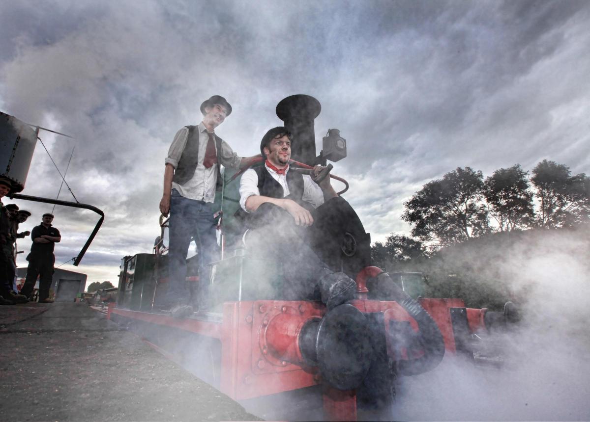 Embsay and Bolton Abbey Steam Railway celebrates 125 years of train journeys on the Skipton to Ilkley line. Driver Pete Burke and fireman Andy Hardy sit on the 1880 steam engine Sir Berkeley amidst a cloud of steam.