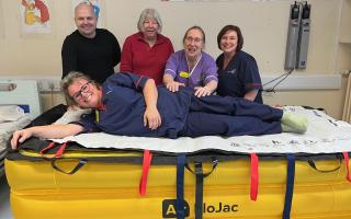 Left to right: Matt Dickinson, Airedale; Alison Dixon, FoA; Vicki Barlow, Airedale; Vicki Egan, Airedale; Anthea Wagstaff, matron, general surgery,  is on the lifting device.